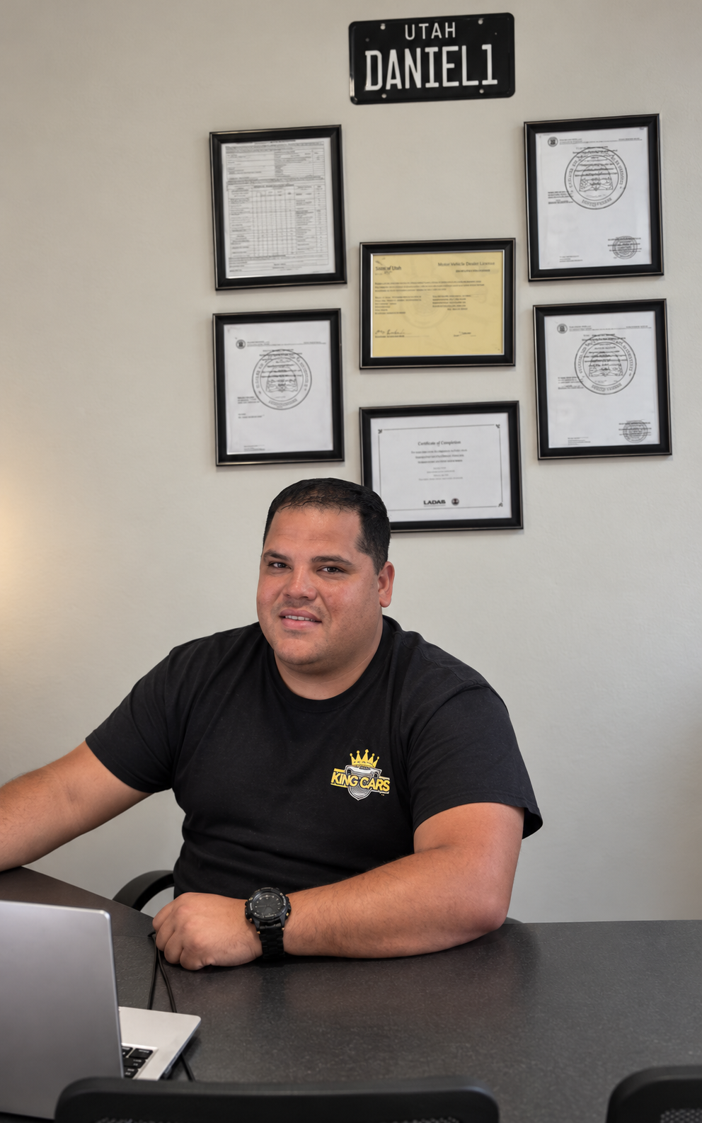 Daniel, owner of The King of Cars LLC, at his office in Springville, Utah
